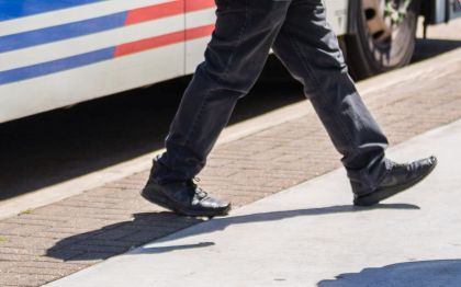 customer walking near metro bus